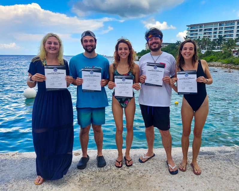 Successful Instructor Candidates from Cozumel Dive Academy's September IDC with there Certificate of Completion after their PADI Instructor Exam